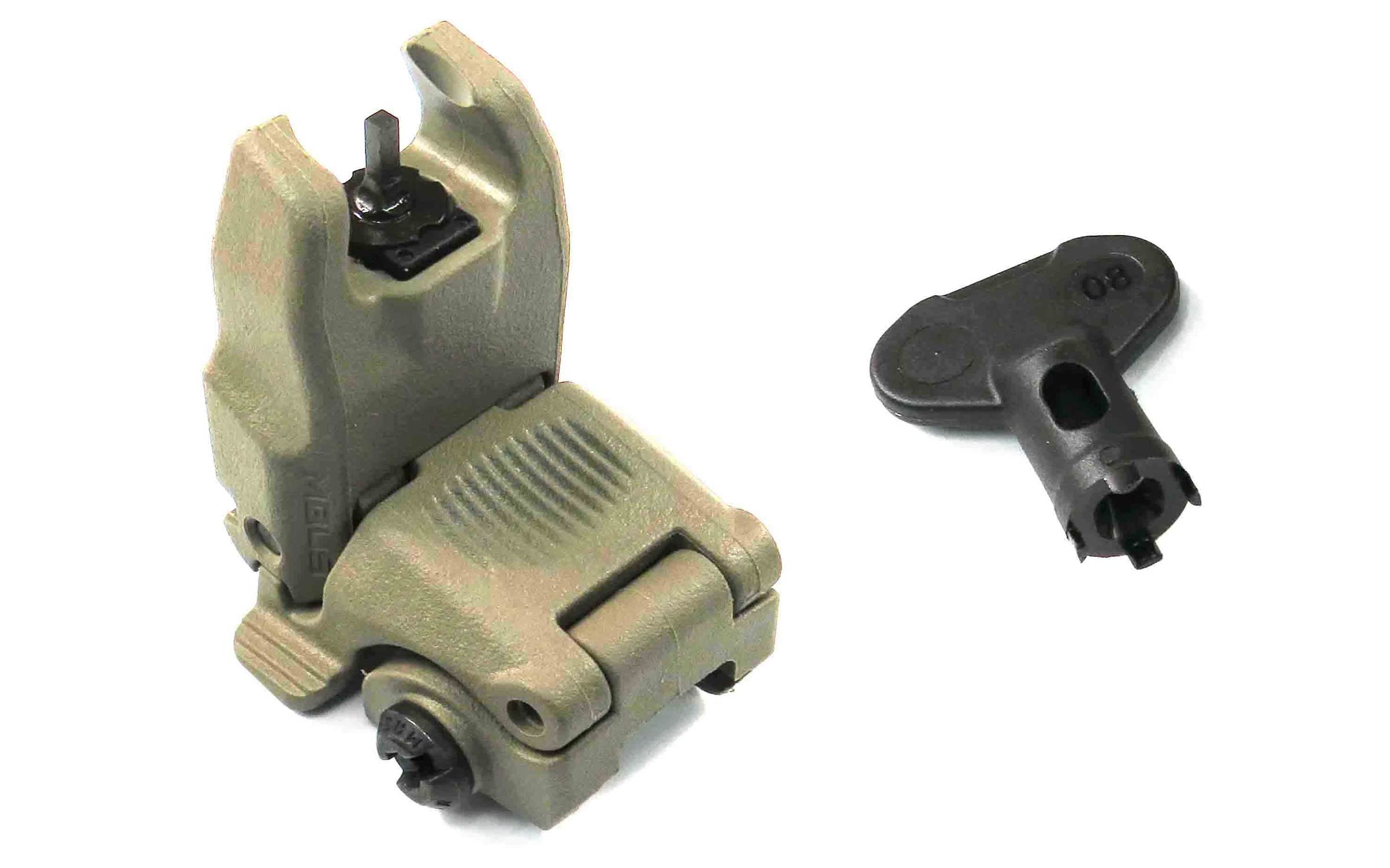 Tan polymer flip-up rear iron sight for a firearm, shown with a black adjustment tool beside it on a white background.
