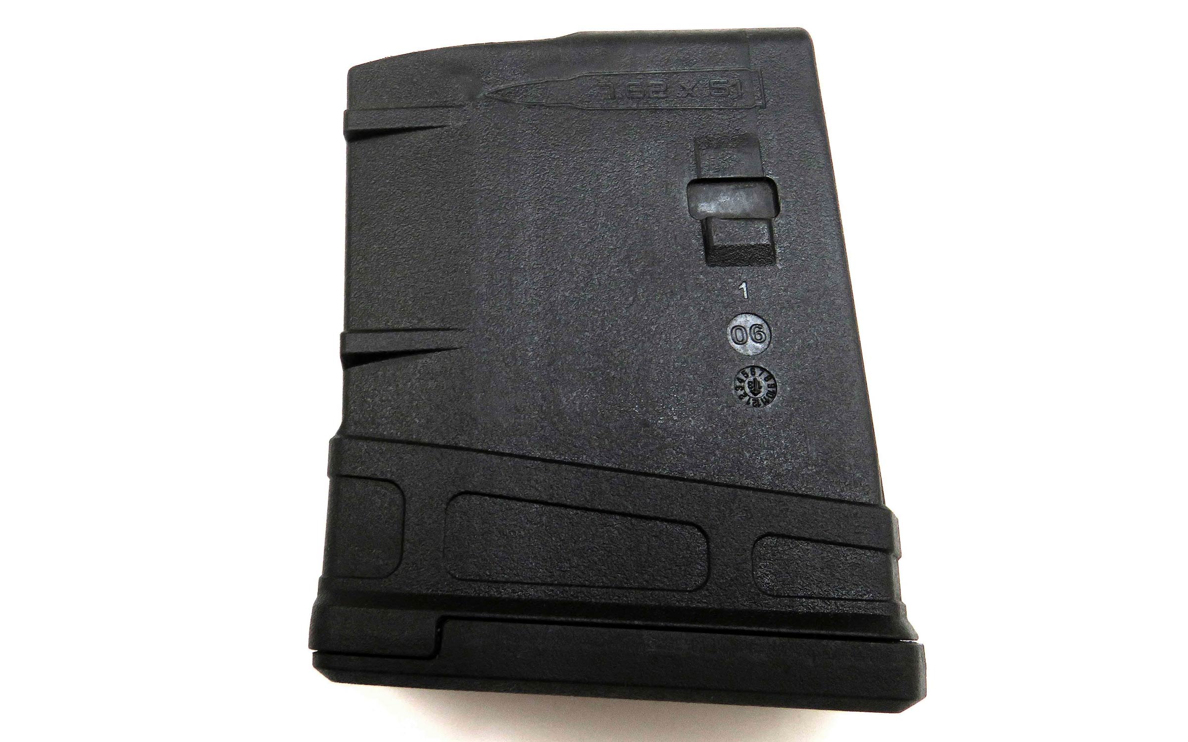 A black, rectangular rifle magazine with textured surfaces and markings, shown against a white background.