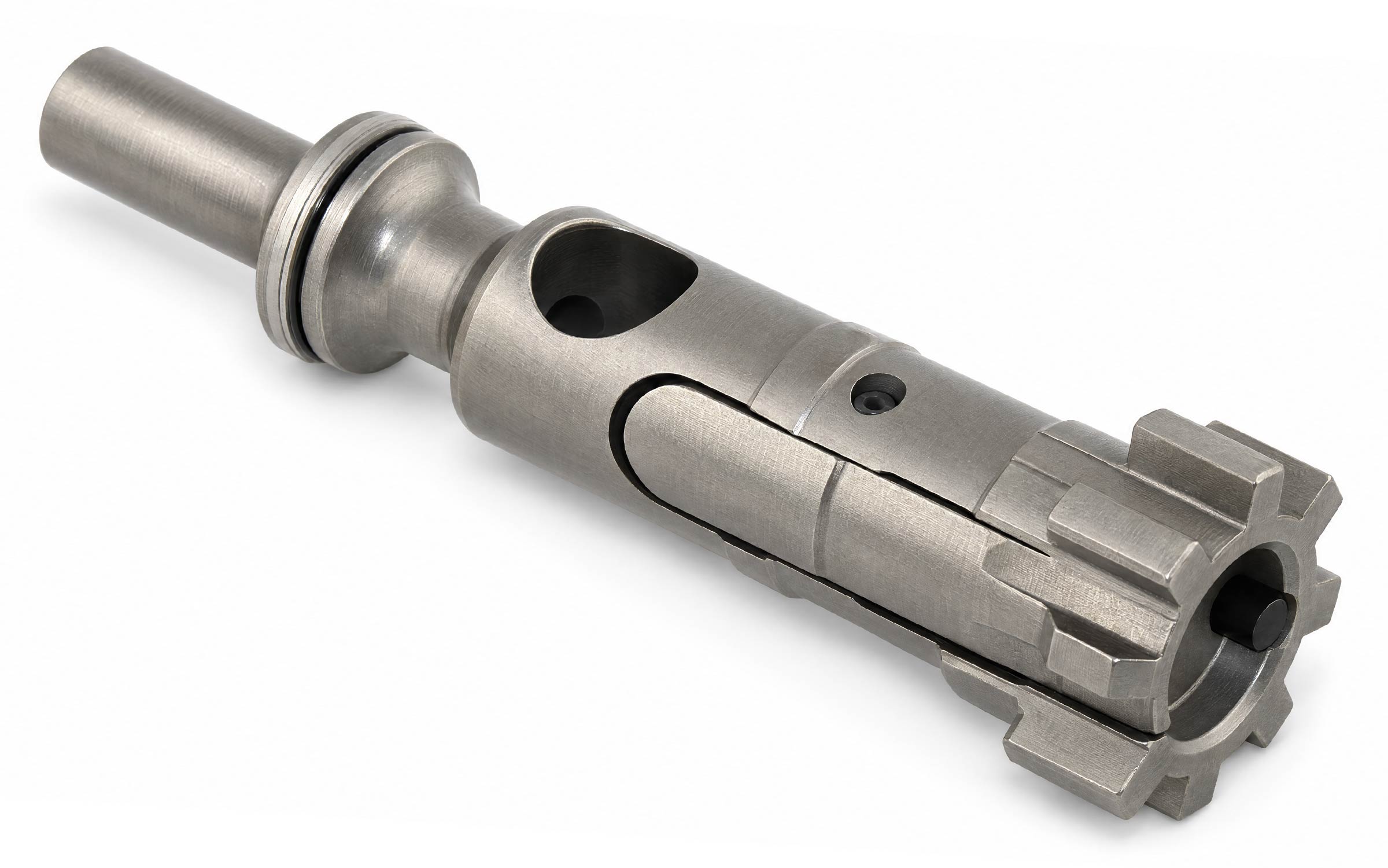 A close-up photo of a metallic bolt carrier assembly for a firearm, showing its machined details, cylindrical shape, and locking lugs on a white background.