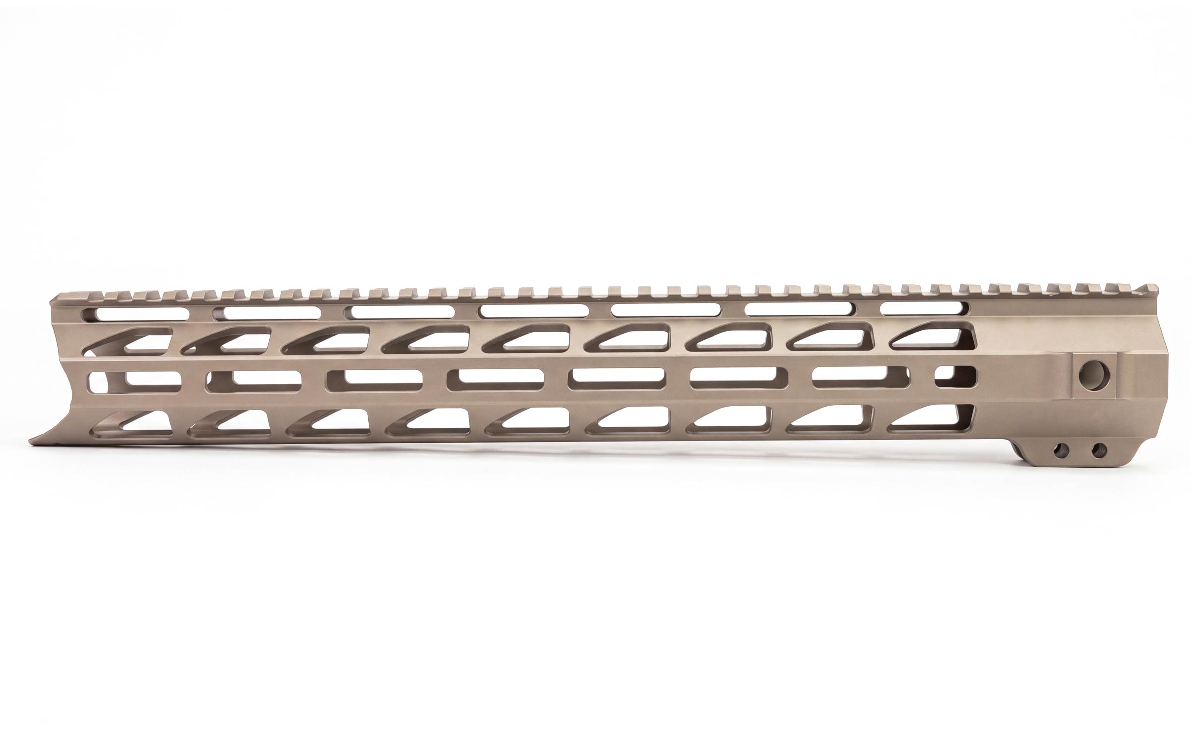 A tan-colored, metal rifle handguard with multiple elongated slots and a rail on top, designed for mounting accessories.