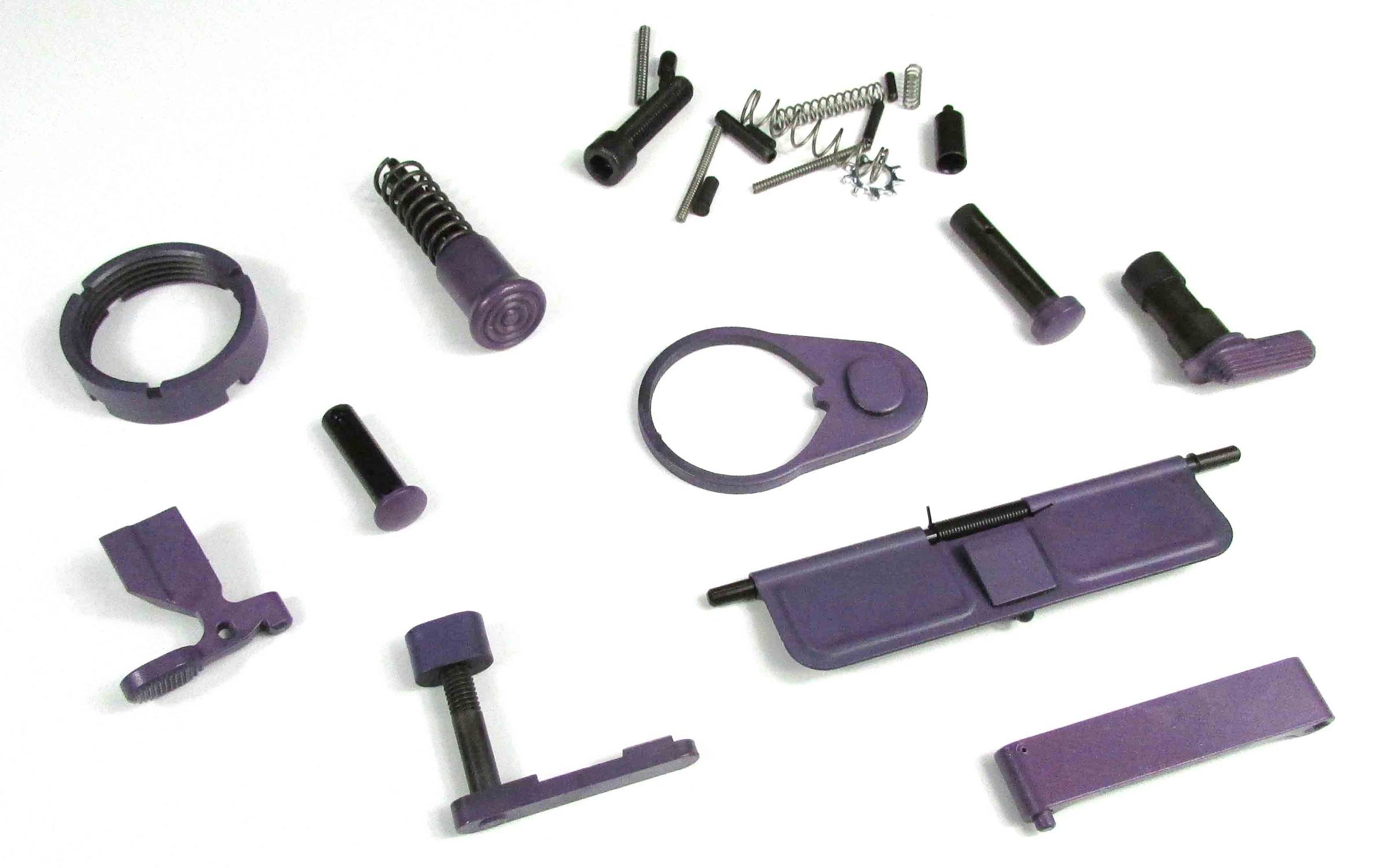 Assorted purple firearm parts and small hardware, including pins, springs, and levers, arranged on a white background.