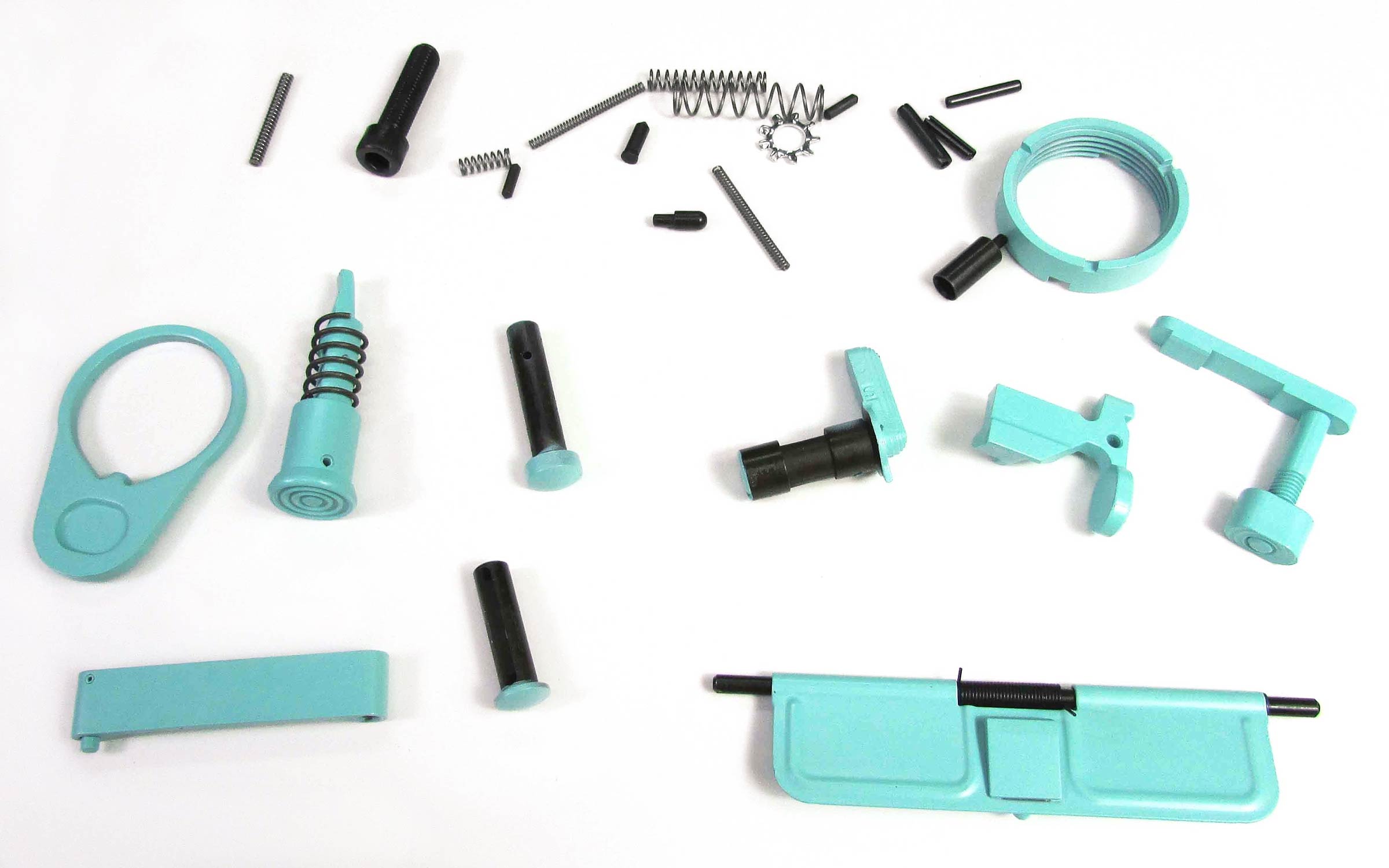 Assorted teal and black firearm parts, including pins, springs, and levers, are spread out on a white background.