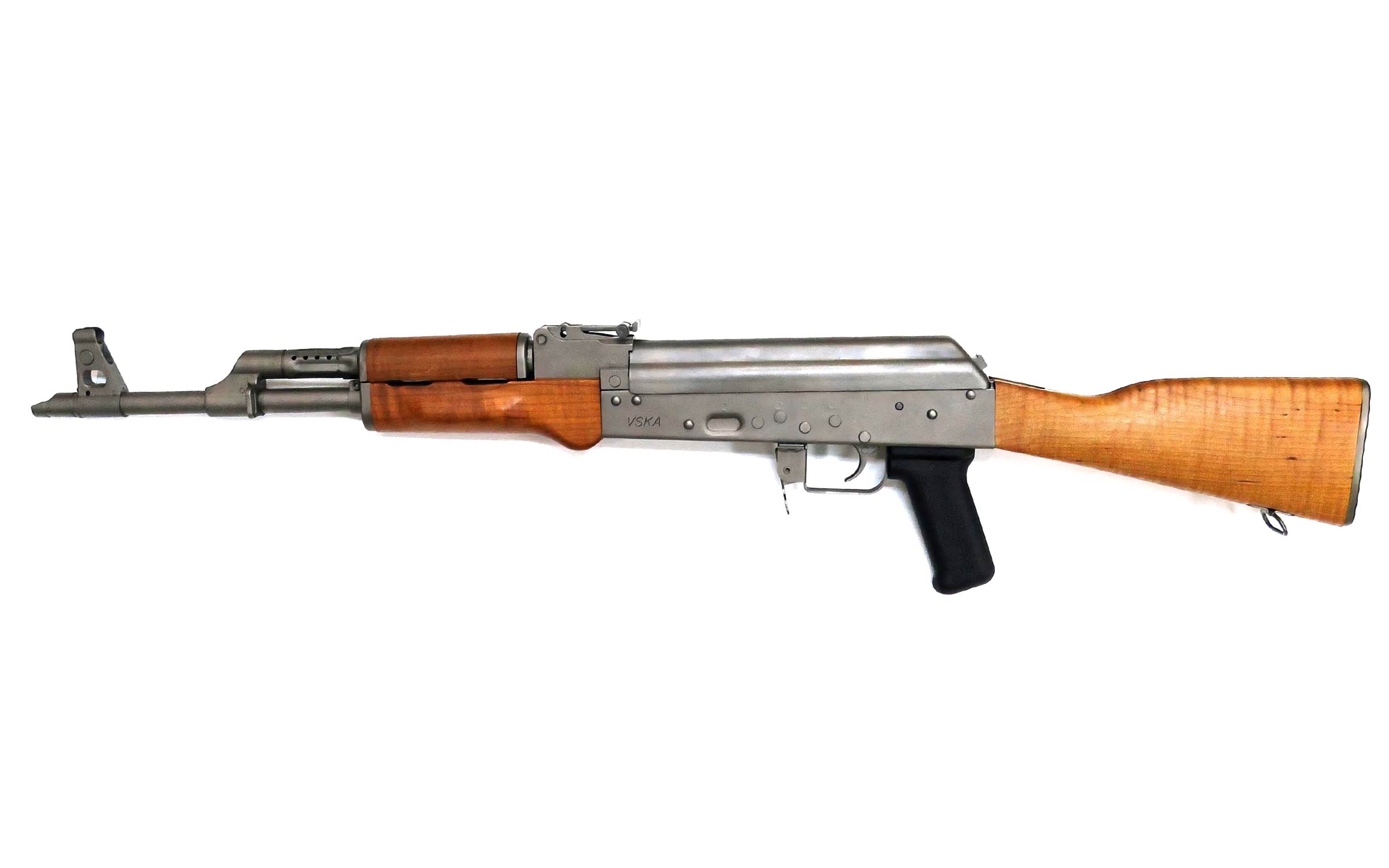 An AK-47 assault rifle with a wooden stock, metal body, and black pistol grip, shown in a side profile on a white background.